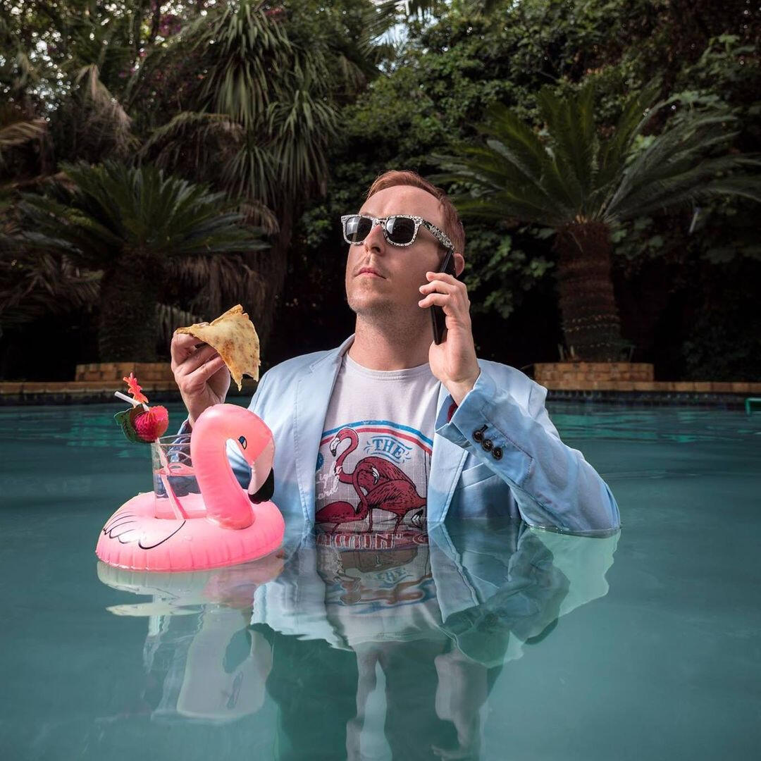 Craig Rawlins-Wilson Craig Rawlins-Wilson in a baby blue suit in a swimming pool